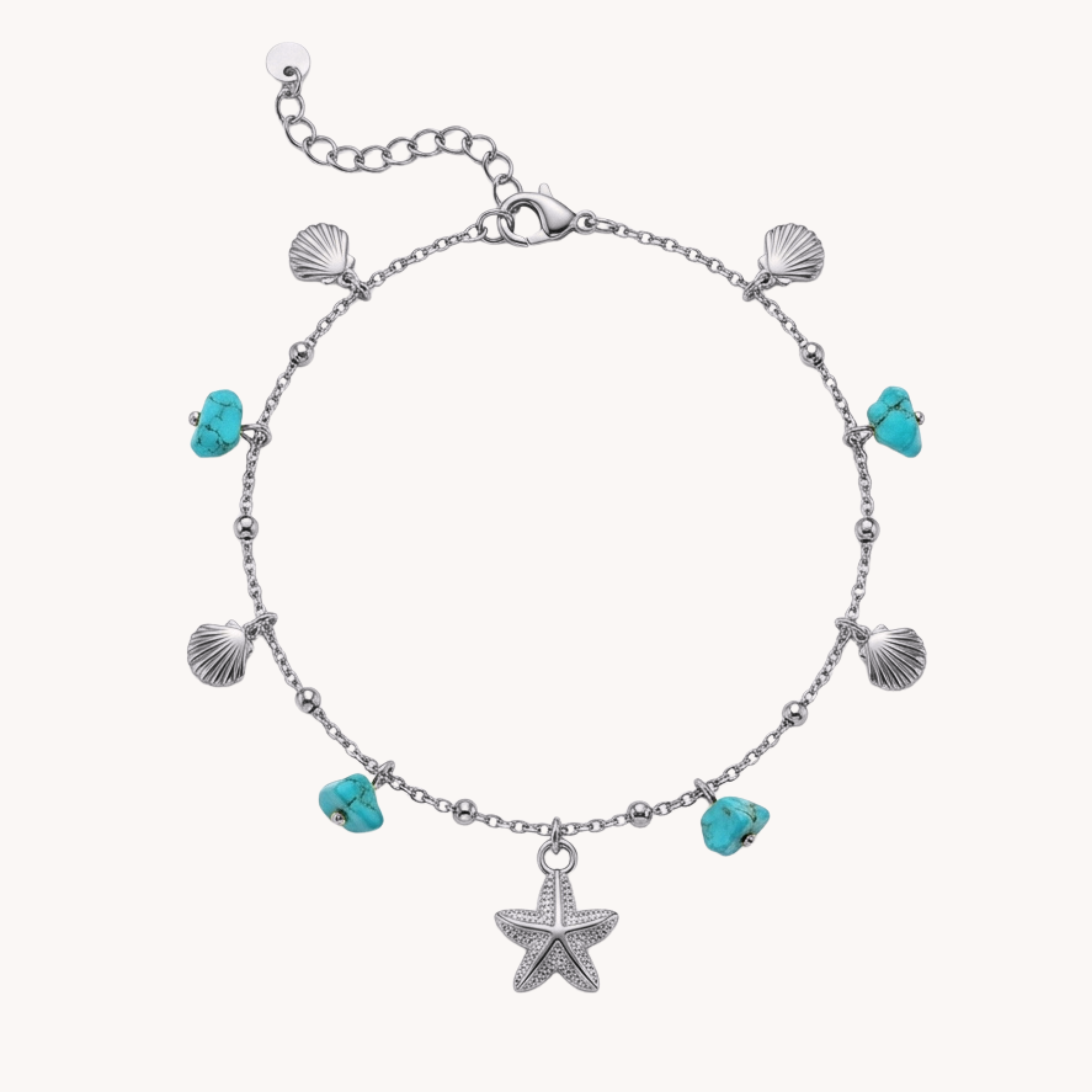 Cavigliera Turquoise Reef Shimmer VANDEM in acciaio oro, cavigliera da donna con ciondoli di conchiglie, stella marina centrale e perle turchesi grezze