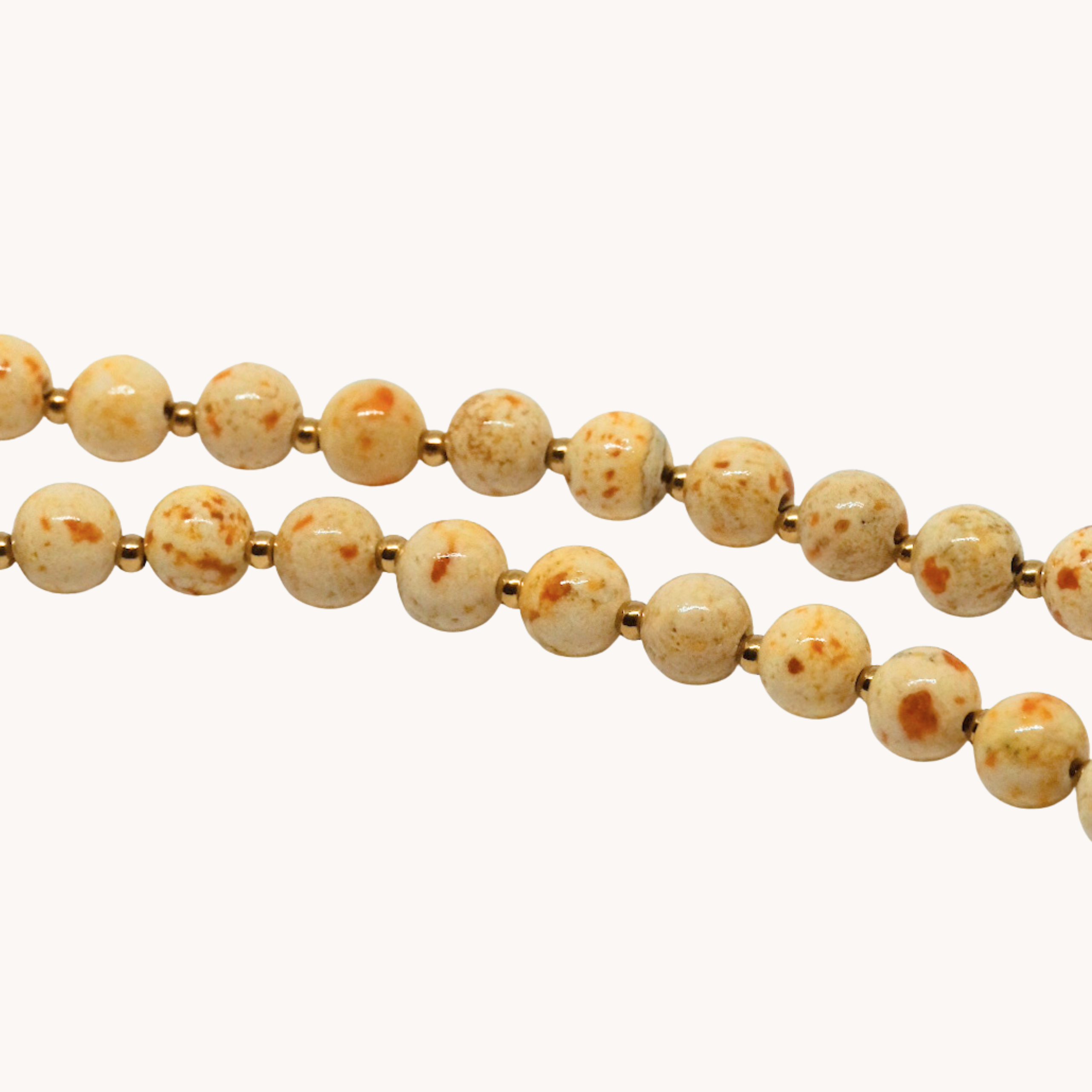 COLLANA PERLE BEIGE CON CORNO