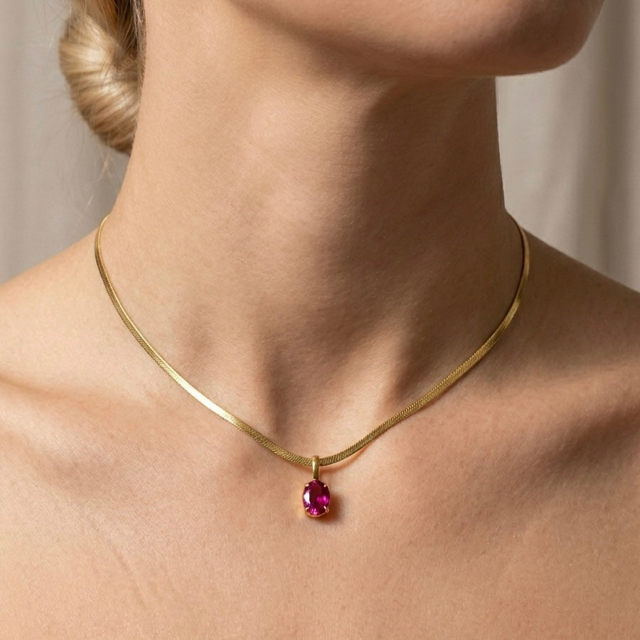 COLLANA SNAKE RUBY - collana a catena piatta snake con ciondolo rubino ovale in acciaio oro