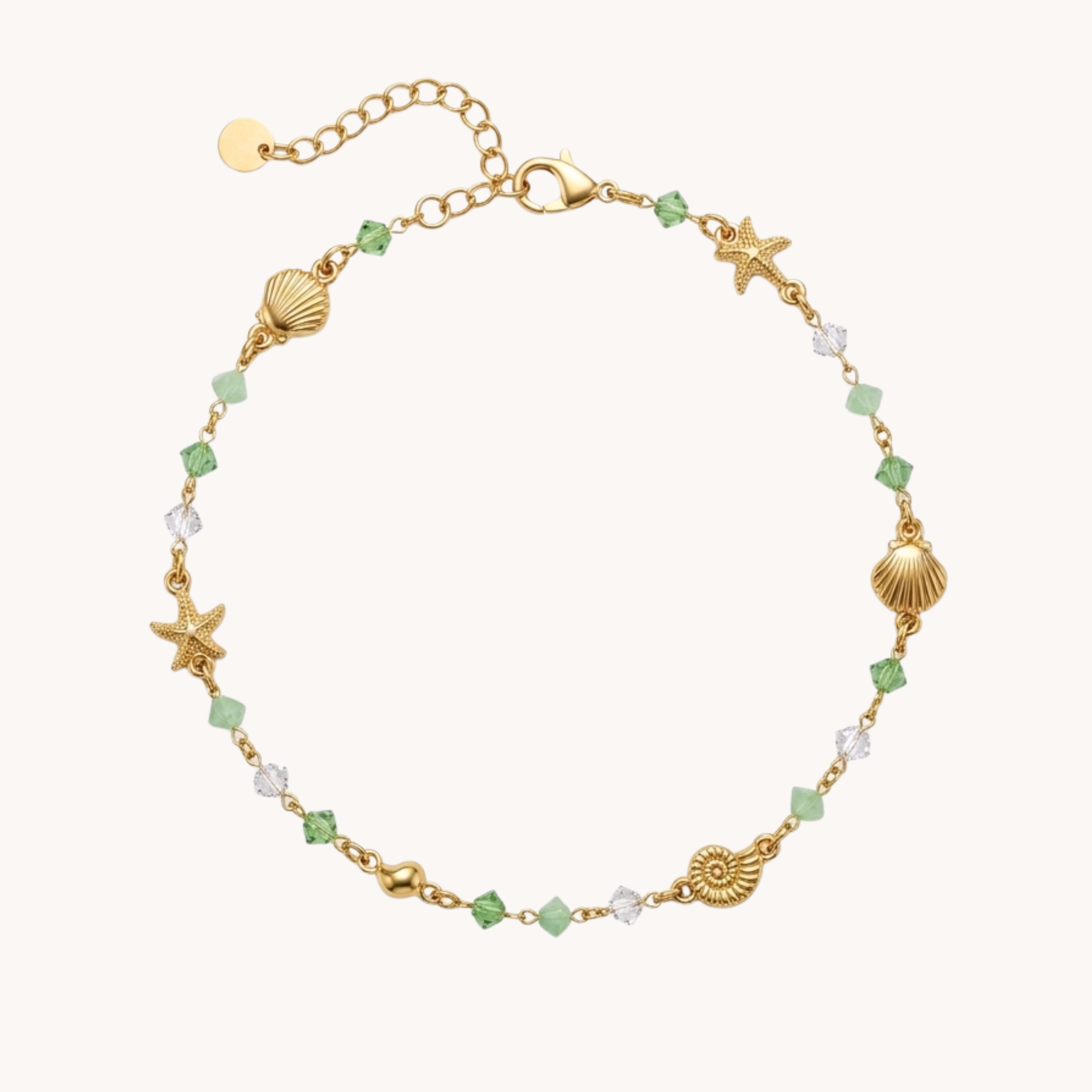 Cavigliera Perline Summer Mint Reef VANDEM, cavigliera da donna con cristalli verdi e bianchi alternati a charm di stelle marine e conchiglie d'oro