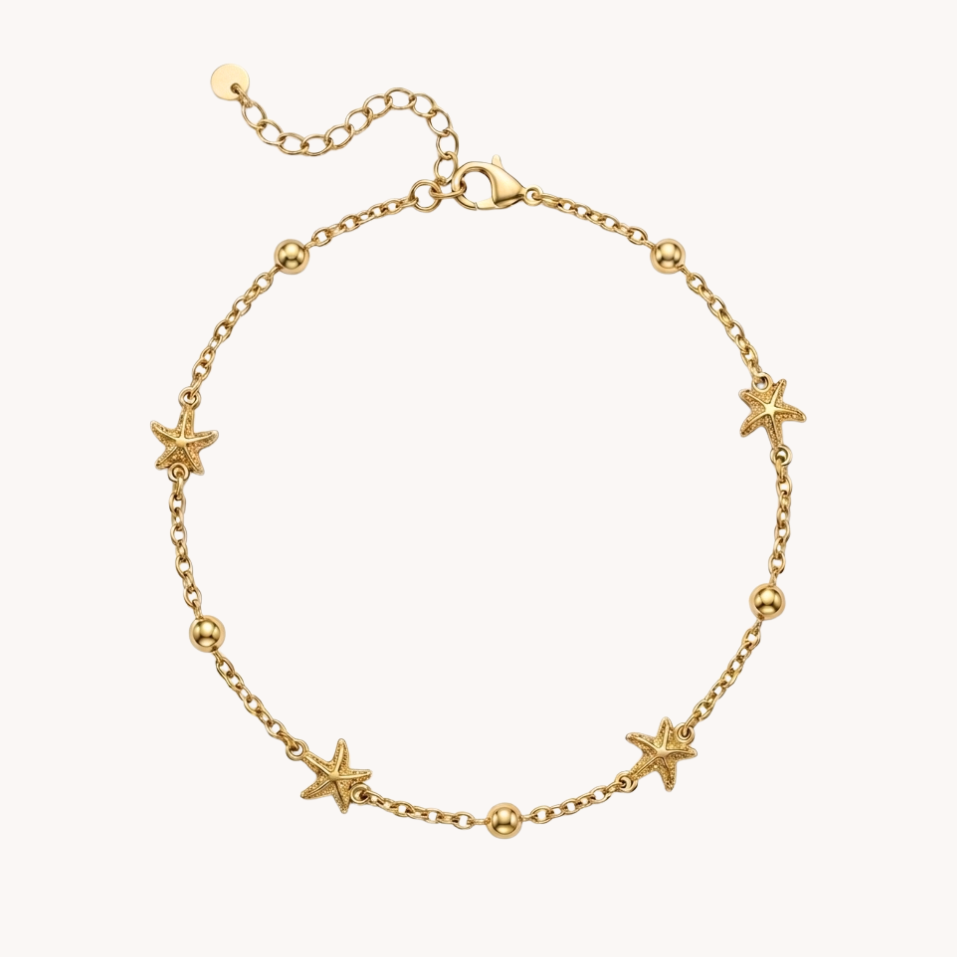 Cavigliera Stelle Marine Starfish Shimmer VANDEM in acciaio oro, cavigliera da donna sottile con catenina a sfere e quattro ciondoli a stella marina lucidi