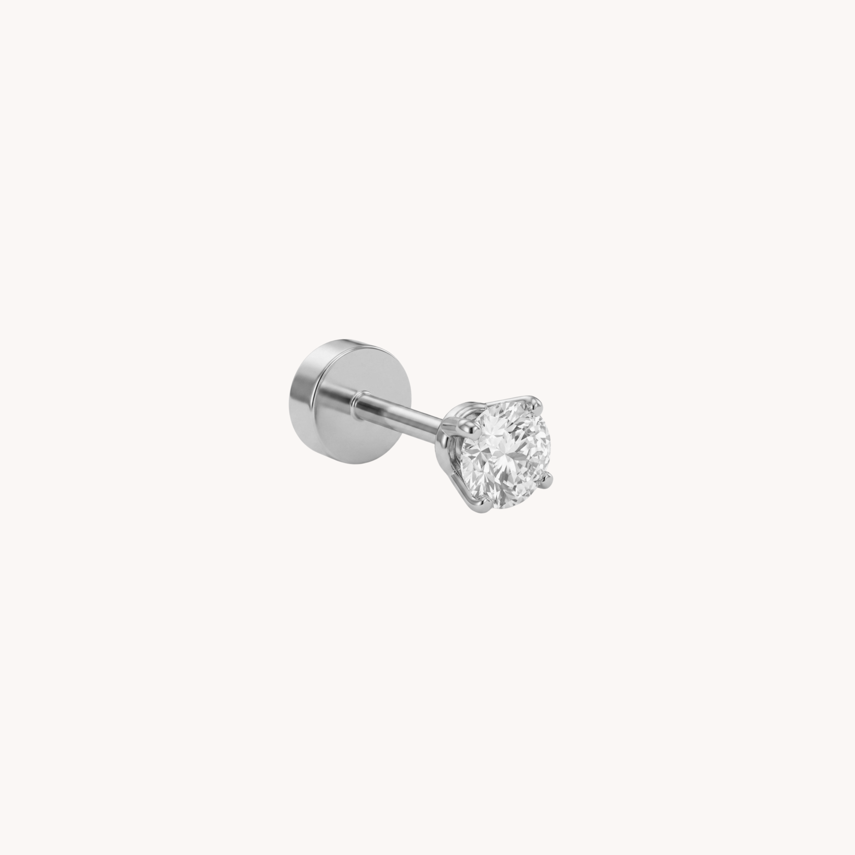 Piercing Punto Luce Solitaire Chic VANDEM in acciaio oro, piercing singolo a perno da donna con castone a griffe e zircone rotondo trasparente lucido.