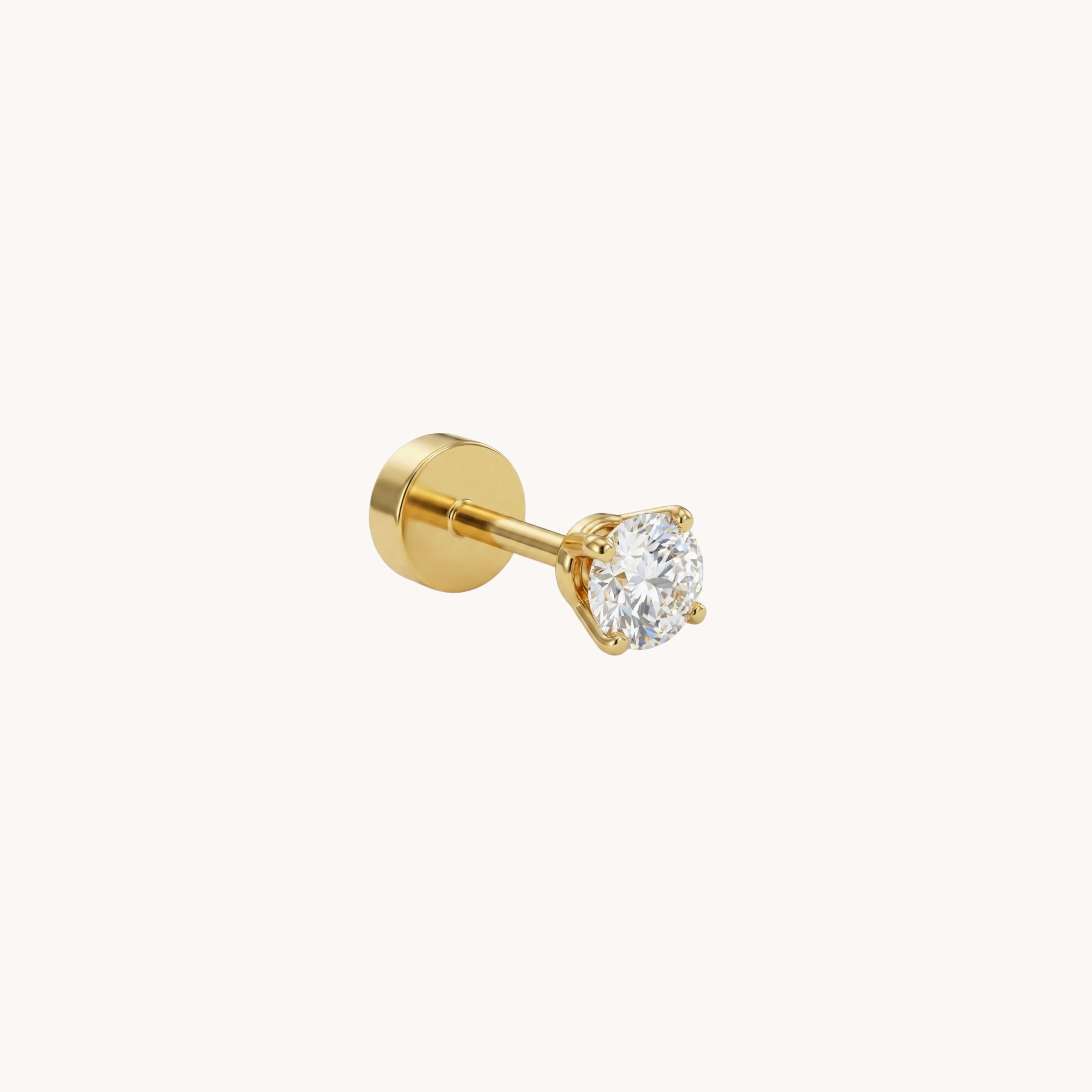 Piercing Punto Luce Solitaire Chic VANDEM in acciaio oro, piercing singolo a perno da donna con castone a griffe e zircone rotondo trasparente lucido.