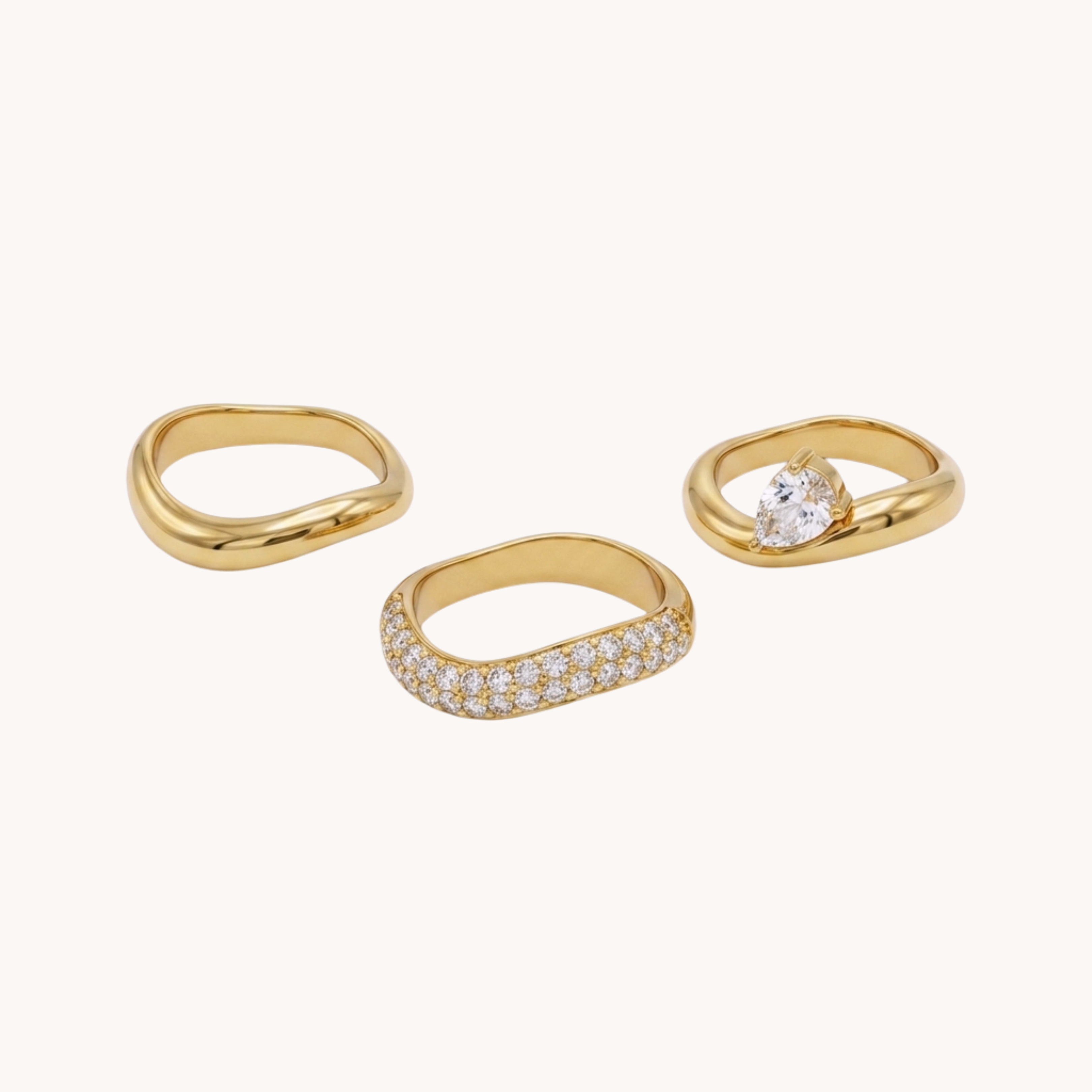 Set 3 Anelli Minimal Sparkle Multirow VANDEM in acciaio oro, tre anelli da donna sovrapposti con pavé di zirconi e solitario centrale a goccia